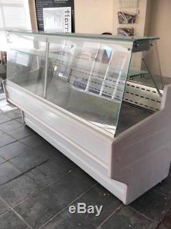 1 year old deli fridge with double storage under counter with marble top